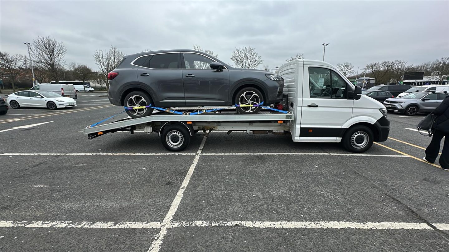 ZRG truck carrying a grey SUV